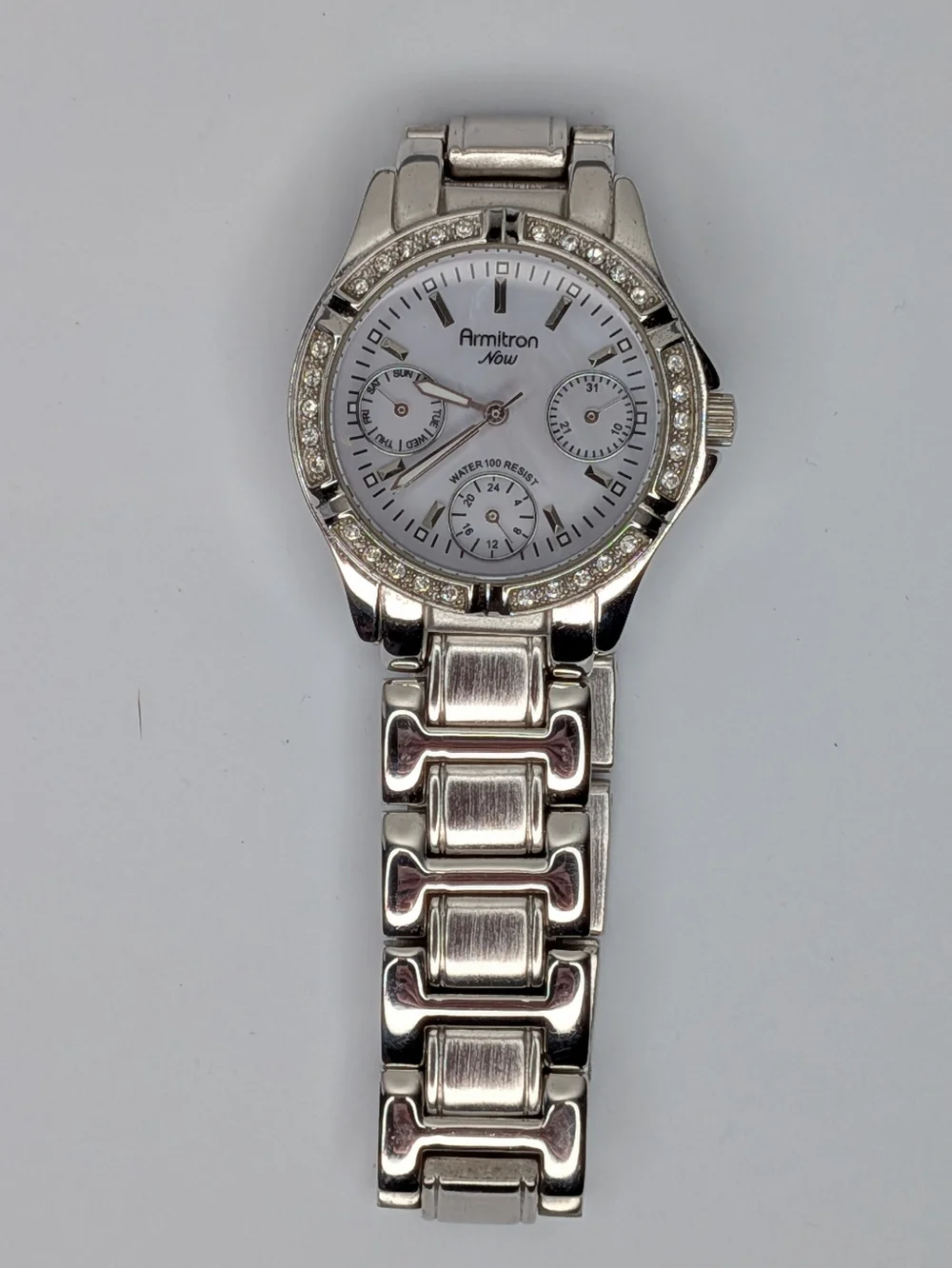 Armitron Now Watch Silver Tone Mother of Pearl Crystal Bezel Water Resistant